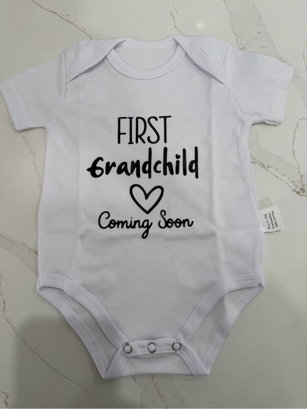 White "First Grandchild Coming Soon" Baby Bodysuit